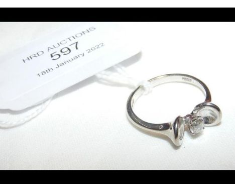An 18ct diamond solitaire ring in unusual setting - size K/L