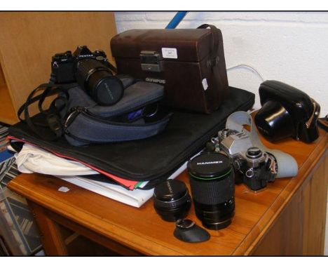 A Pentax Camera with lenses, together with an Olympus, etc. 