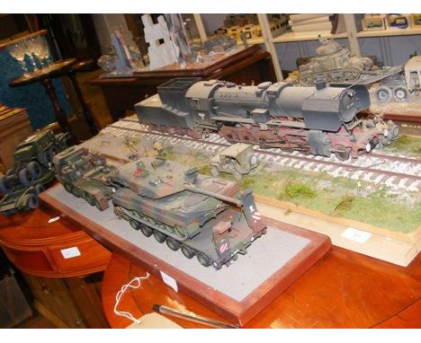 A model train on track, together with model Army vehicles and tank CONDITION REPORTplastic construction