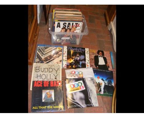 A batch of 12 inch vinyl records, including The Beatles, Prince, Michael Jackson and Elton John, etc. 