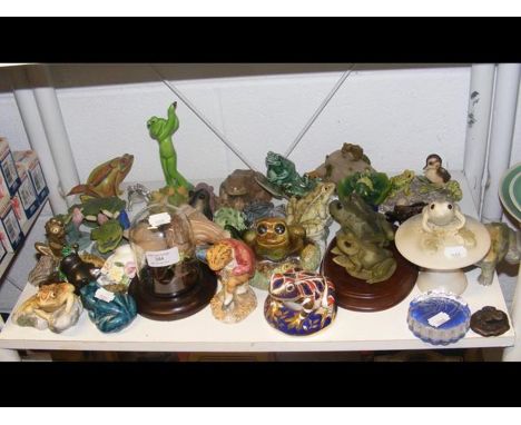 A Royal Crown Derby 'Frog' paperweight, together with other ceramic frogs 