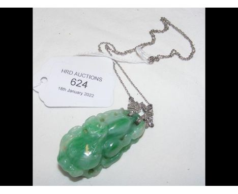 A jade and diamond pendant on chainCONDITION REPORTgood condition6cm x 1cmno hallmarks34.8glength 6cmwidth 3cmdepth 2cmas per