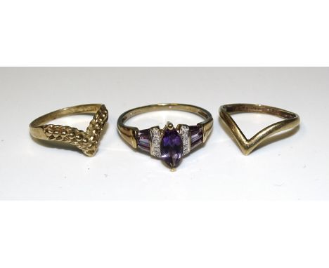 A 9ct gold amethyst and diamond ring, size U½, 2.4g and two 9ct gold wishbone rings, 2.3g, (3). 