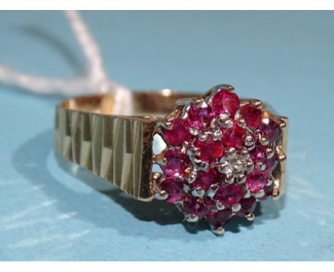 A 9ct gold ruby and diamond cluster ring, size R, 3.9g. 