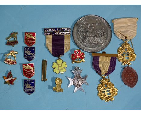A small collection of badges, including two pre-1960 Olympic Games British Equestrian Team badges, two Olympic Games 1960 red