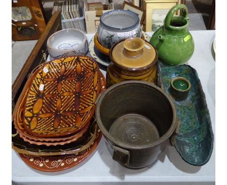 A pottery planter with impressed mark AM, 20cm high, various slipware dishes and pottery, (a quantity). 