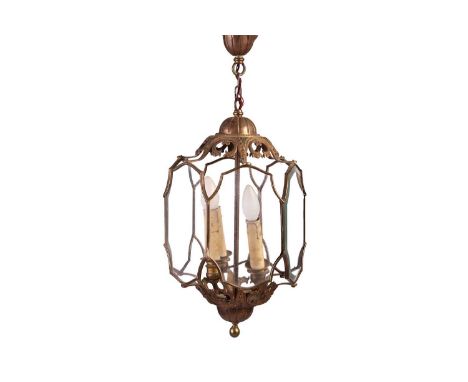 A George III style gilt brass portico lantern, 20th century, fitted three sconces and eight-shaped glazed panels with domed t