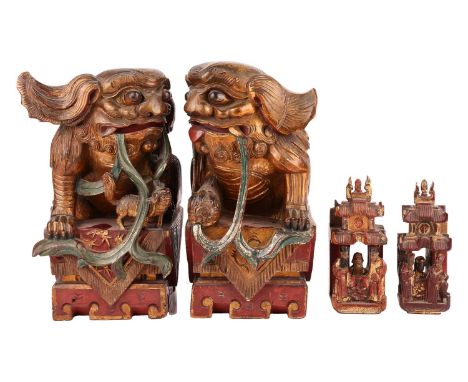 A large pair of Chinese red lacquered and parcel-gilt wood architectural Dog of Foo finials, probably late 19th century, 21 c
