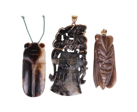 A Chinese carved variegated dark green jade pendant in the form of an archaistic ceremonial axe head with kylin mount and yel