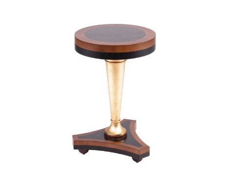 Soher, a contemporary circular pedestal table with cross banded blackwood ebony top, supported on a turned and gilt central p