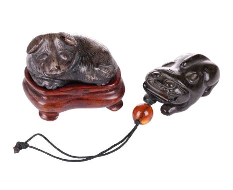 A Chinese dark green jade toggle in the form of a corpulent tiger thought to be Tang Dynasty, (618 AD- 907AD), see bill of sa