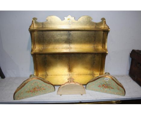 Gold coloured wall shelf and three painted console tables