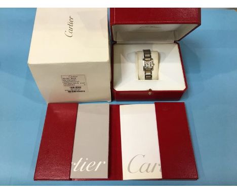 A Cartier ladies stainless steel ‘Tank’ watch, model number 2384, case number 765337 UF (boxed, instructions and outer sleeve