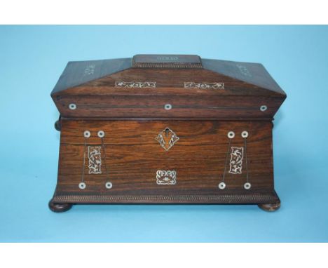 A 19th century rosewood and mother of pearl inlaid tea caddy on bun feet, 31cm