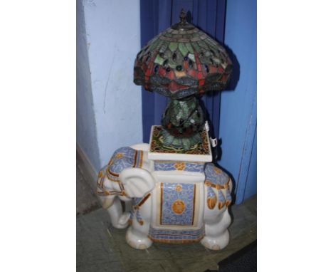 An elephant stool and a Tiffany style lamp