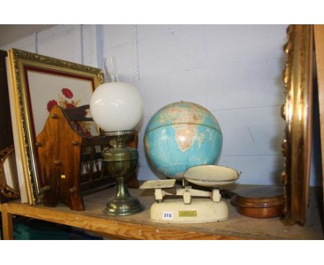 Shelf of assorted, including an oil lamp