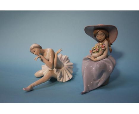 A Lladro figure of a girl holding flowers and a ballerina figure (2)