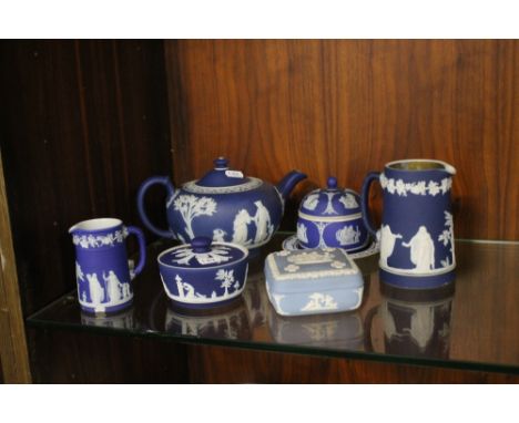 A COLLECTION OF BLUE WEDGWOOD JASPERWARECondition Report: The teapot has a small chip to the lid finial, general marks to the
