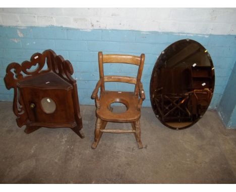A CHILDS COMMODE CHAIR, A VINTAGE CORNER WALL CUPBOARD A/F AND A VINTAGE OVAL WALL HANGING MIRROR  (3)