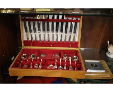A CASED CANTEEN OF CUTLERY TOGETHER WITH A BAROMETER