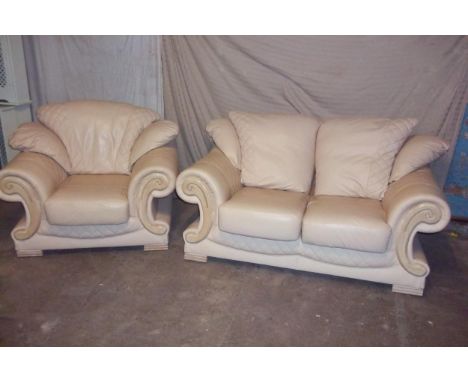 A CREAM LEATHER TWO PIECE PENDRAGON STYLE SUITE TO INCLUDE A TWO SEATER SOFA AND A CHAIR