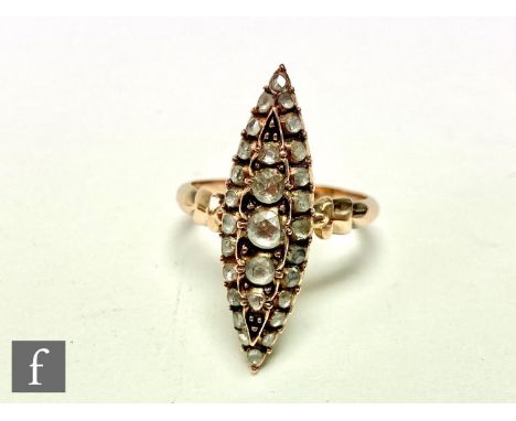 A late 19th Century 9ct diamond marquise shaped diamond cluster ring set with five central graduated rose cut diamond within 