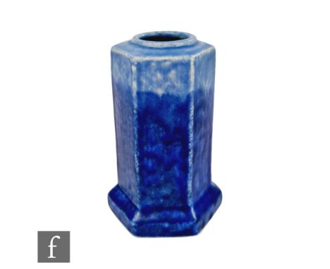 A small Ruskin Pottery vase of hexagonal form decorated in a streaked tonal blue glaze, tubed mark to the base, height 12cm, 