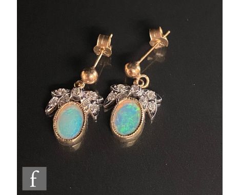 A pair of 9ct opal and diamond drop earrings, foliate diamond set stud above a collar set oval opal drop, weight 1.6, length 