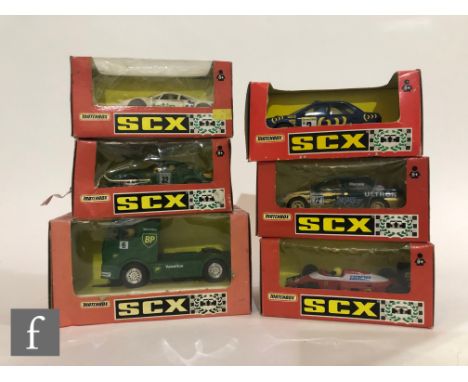 A collection of six Matchbox SCX slot cars, to include 86340 Mercedes Truck, 8377 Subaru Impreza, 83720 Ferrari F1, 83340 Peu