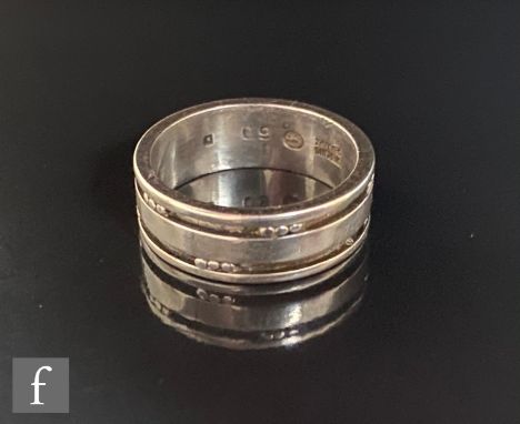 A Danish silver band ring detailed with twin channels each highlighted with triple dot details, weight 4.7g, ring size L 1/2,