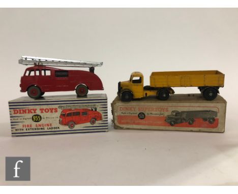 Two Dinky Supertoys, a 521 Bedford Articulated Lorry in yellow and black in box with picture label, and a 955 Fire Engine wit