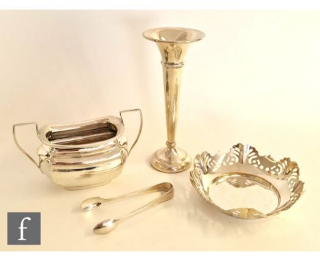 Four items of silver to include a sugar basin, a small bon bon dish, a trumpet vase and a pair of sugar tongs, total weight o