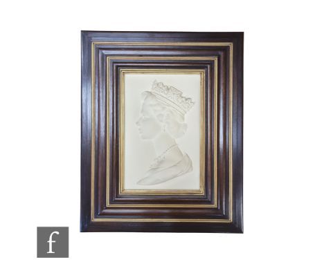 A large framed Royal Worcester portrait plaque of Her Majesty Queen Elizabeth II in profile, by Arnold Machin O.B.E R.A, made