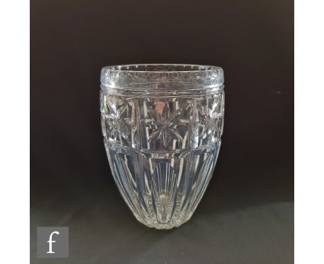 A 1930s Stuart &amp; Son clear cut crystal vase of swollen barrel form with a mitre cut panel design with star and arch motif