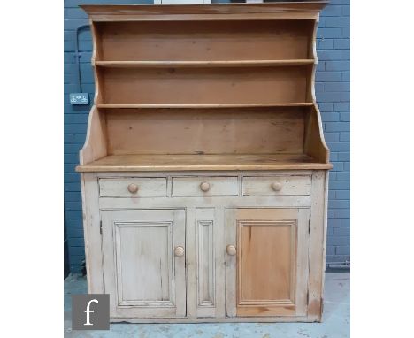 A late 19th to early 20th Century Scotch stripped pine dresser, the plate rack upright section above three frieze drawers and