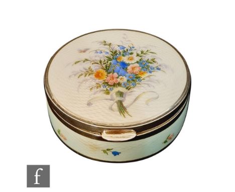 A continental silver and enamel decorated circular trinket box, the hinged lid with a tied bouquet of wild flowers to a white