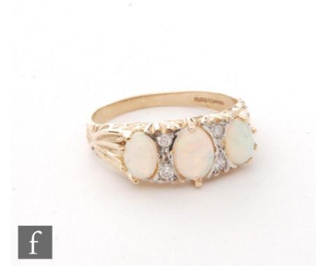 A 9ct hallmarked opal and diamond seven stone ring, three opals spaced by two pairs of diamonds, ring size Q. 