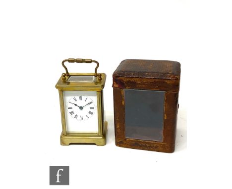 A late 19th century French brass carriage clock in leather carrying case, height 11.5cm. 