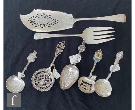 A William IV hallmarked silver fish slice, London 1833, with a similar fork, two Dutch souvenir spoons, and three further Ste