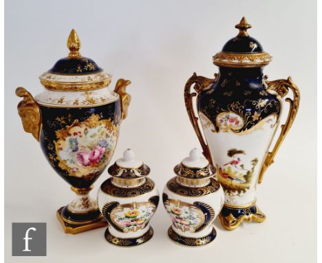 An early 20th Century Coalport twin handled lidded vase decorated with a hand painted cartouche panel to the front and a garl