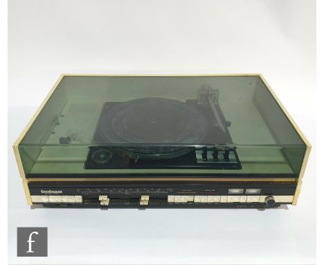 A Goodmans Module Ninety turntable record player, with built in Tuner radio, in white casing with perspex cover. 