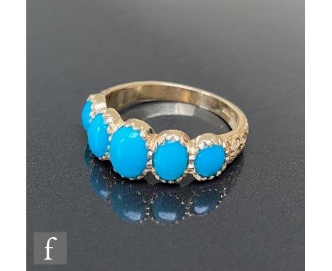 A 9ct hallmarked Victorian style graduated five stone turquoise ring, oval claw set stones to foliate decorated shoulders, we