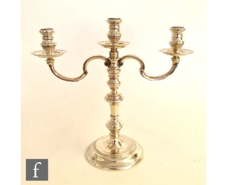 A hallmarked silver small three light candelabrum, circular stepped base below knopped stem and circular sconces, weight 11oz