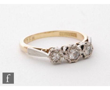 A mid 20th Century 18ct diamond three stone ring, transitional cut illusion set stones to platinum shoulders, weight 3g, ring