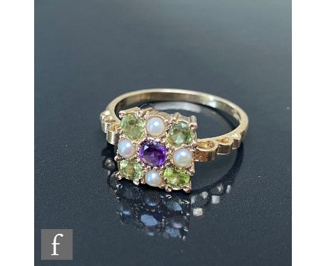 A 9ct hallmarked Edwardian style amethyst, peridot and seed pearl ring, central amethyst within alternating stones to border,