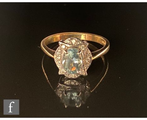 A 9ct hallmarked blue topaz and diamond cluster ring, central oval topaz within an oval set diamond border, weight 2.6, ring 