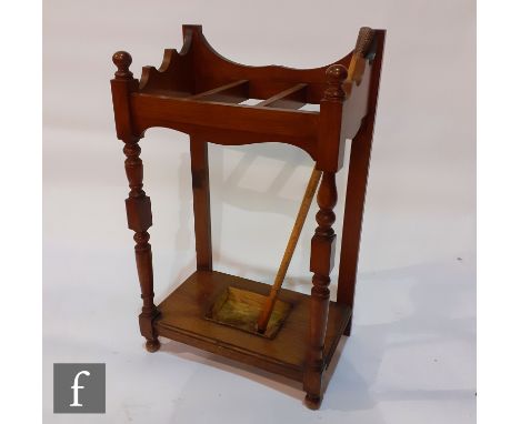 A Victorian light oak umbrella stand, shaped back and turned supports, height 92cm x depth 34cm x width 54cm, and a silver to