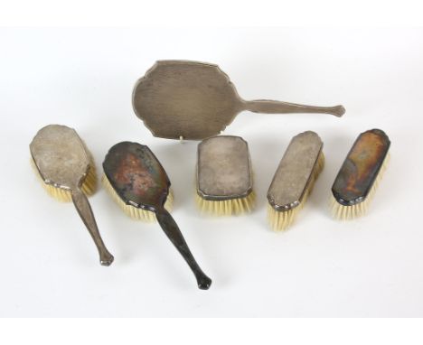 George VI engine turned silver dressing table set comprising, hand mirror, pair of hair brushes and a pair of clothes brushes