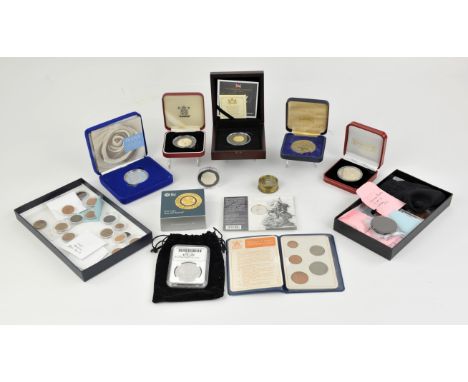 A collection of both silver proof and circulated coins and other items.including a privately made 1 ounce silver round in a p