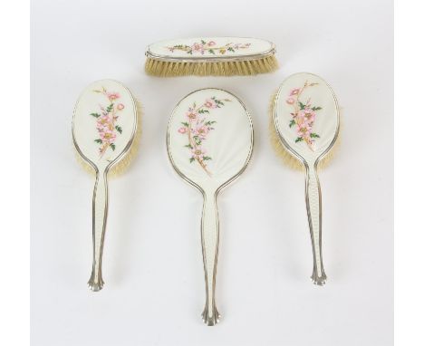 Silver and white guilloche enamel dressing table set comprising hand mirror, two hair brushes and a clothes brush decorated w